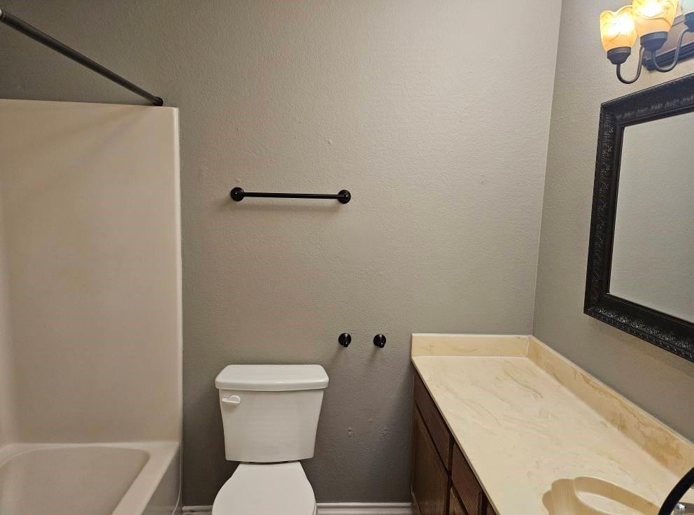 12 Trails Place, Unit AD Wylie, TX 75098 - Photo 2 of 40 a bathroom with a toilet a sink and a bathtub