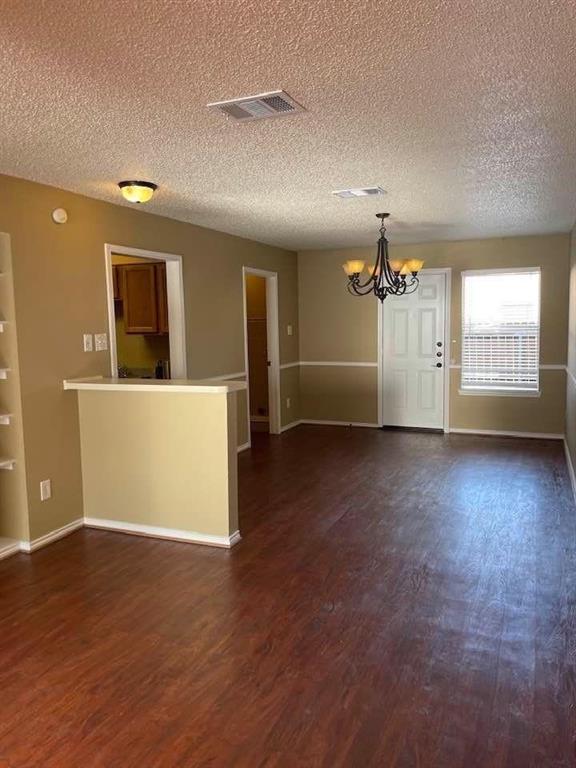 12 Trails Place, Unit AD Wylie, TX 75098 - Photo 26 of 40 an empty room with wooden floor and windows