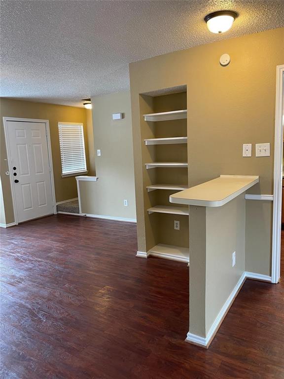 12 Trails Place, Unit AD Wylie, TX 75098 - Photo 29 of 40 a view of kitchen and hallway with wooden floor