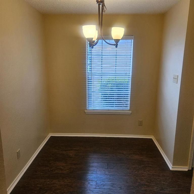 12 Trails Place, Unit AD Wylie, TX 75098 - Photo 31 of 40 a view of a room with wooden floor and windows