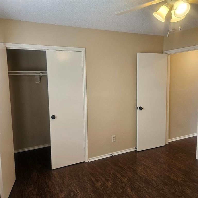 12 Trails Place, Unit AD Wylie, TX 75098 - Photo 37 of 40 a view of an empty room with wooden floor and a window