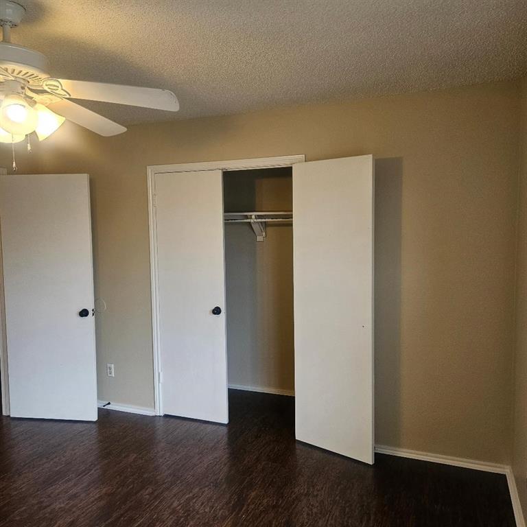 12 Trails Place, Unit AD Wylie, TX 75098 - Photo 39 of 40 a view of an empty room with wooden floor