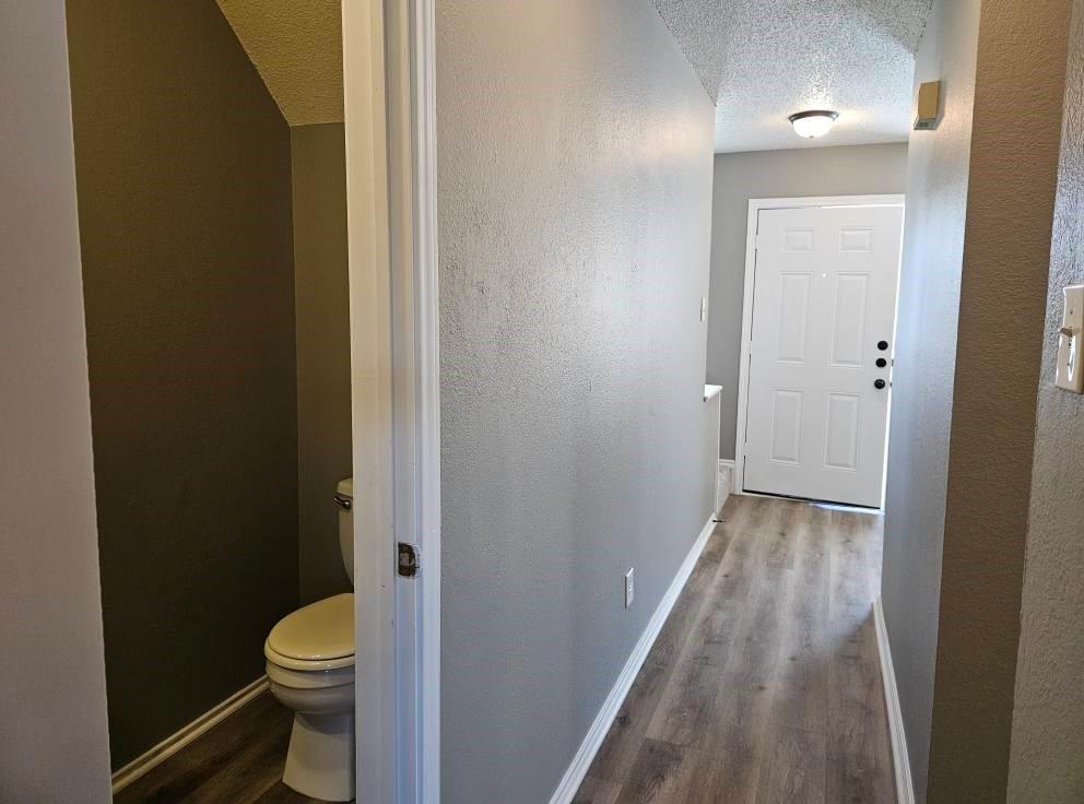 12 Trails Place, Unit AD Wylie, TX 75098 - Photo 5 of 40 a bathroom with a granite countertop toilet and a sink
