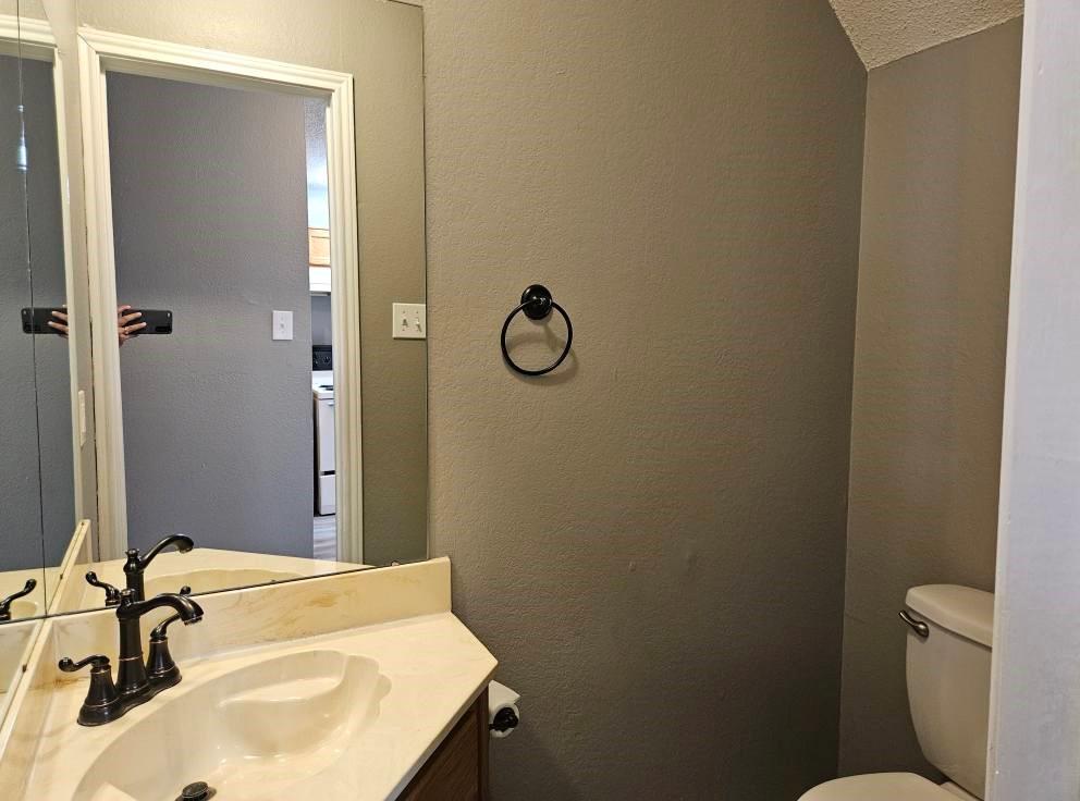 12 Trails Place, Unit AD Wylie, TX 75098 - Photo 7 of 40 a bathroom with a sink and a mirror