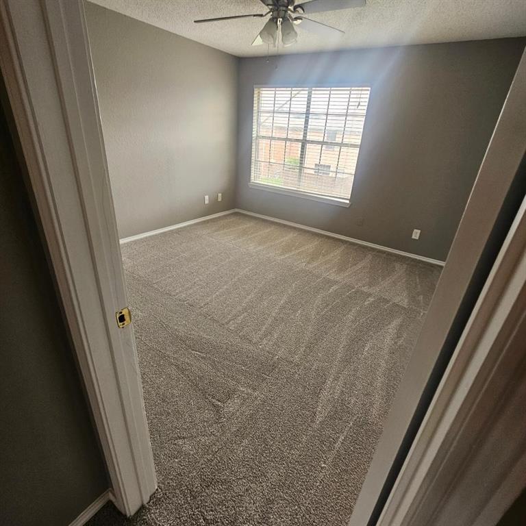 12 Trails Place, Unit AD Wylie, TX 75098 - Photo 10 of 40 a view of an empty room and a window
