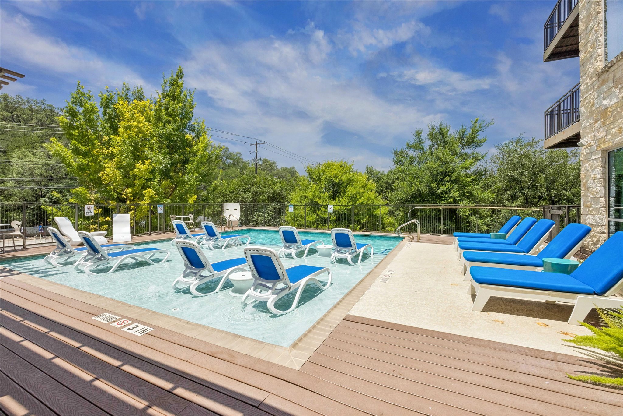 1900 Barton Springs Road, Unit 4041 Austin, TX 78704 - Photo 28 of 35 Lounge poolside on sun-drenched days with ample space for relaxation.
