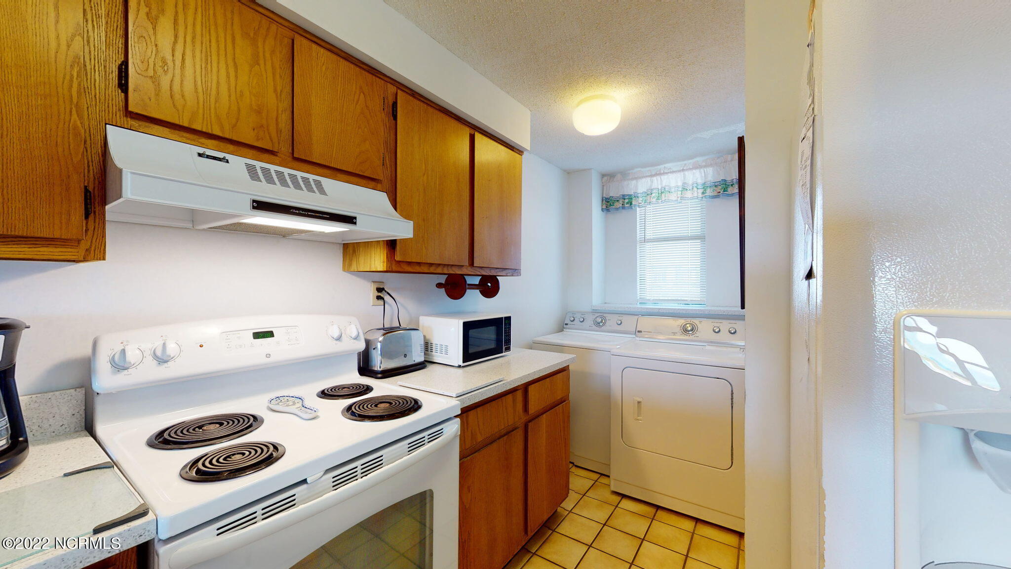 1505 Salter Path Road, Unit A212 Atlantic Beach, NC 28512 - Photo 5 of 33 Kitchen w/washer & dryer