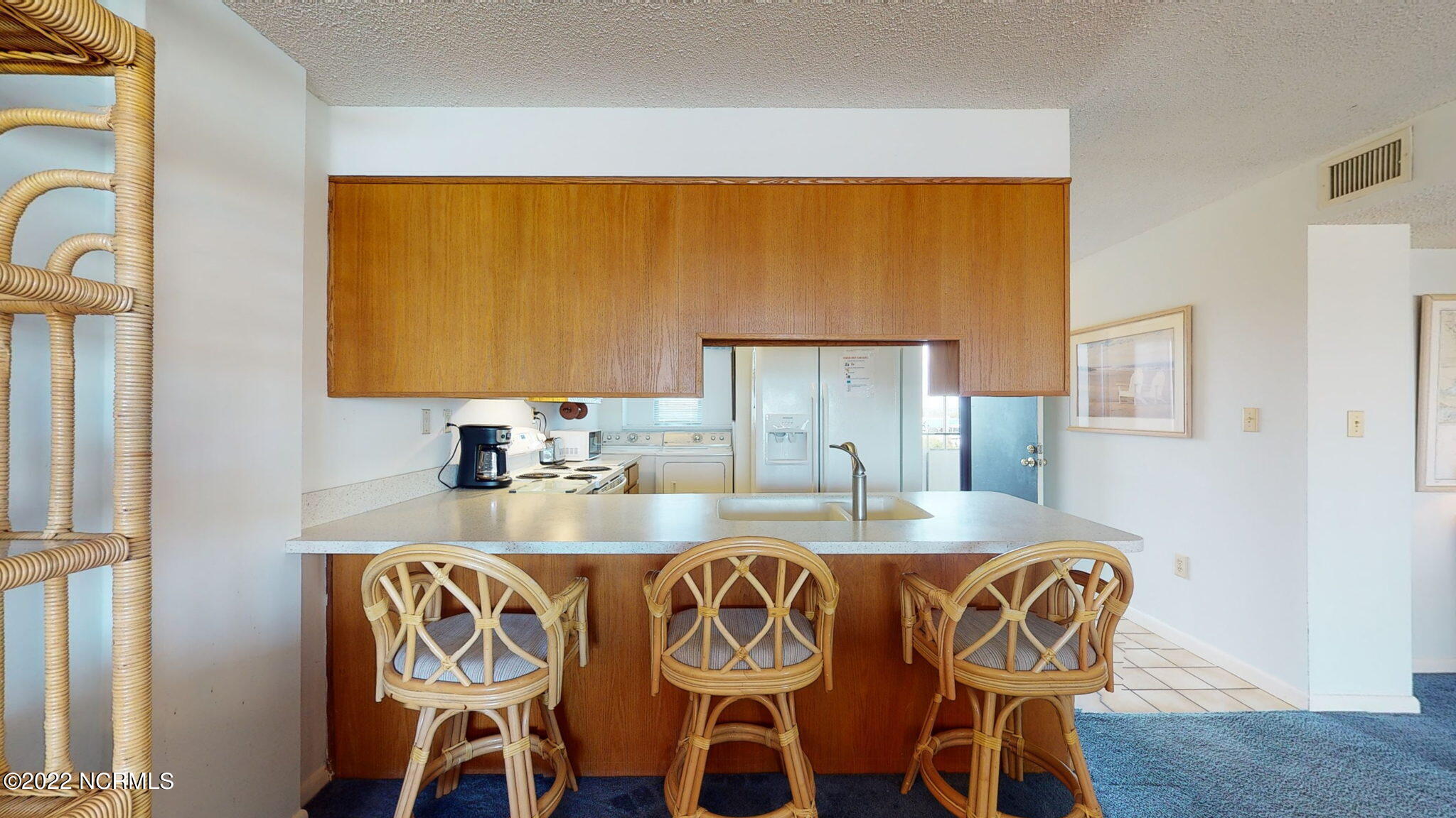 1505 Salter Path Road, Unit A212 Atlantic Beach, NC 28512 - Photo 7 of 33 Kitchen/Breakfast Bar