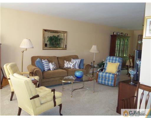 804 Maplecrest Road Edison, NJ 08820 - Photo 2 of 12 a living room with furniture and a lamp