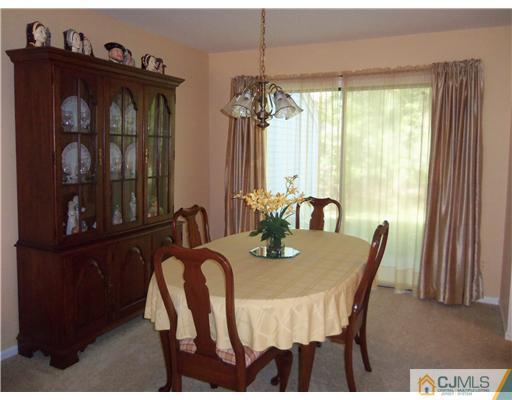 804 Maplecrest Road Edison, NJ 08820 - Photo 3 of 12 a view of a dining room with furniture window and outside view