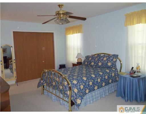804 Maplecrest Road Edison, NJ 08820 - Photo 5 of 12 a bedroom with a bed and a window