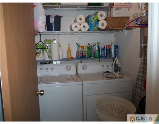 804 Maplecrest Road Edison, NJ 08820 - Photo 8 of 12 a utility room with dryer and washer