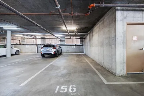 a view of parking garage with cars