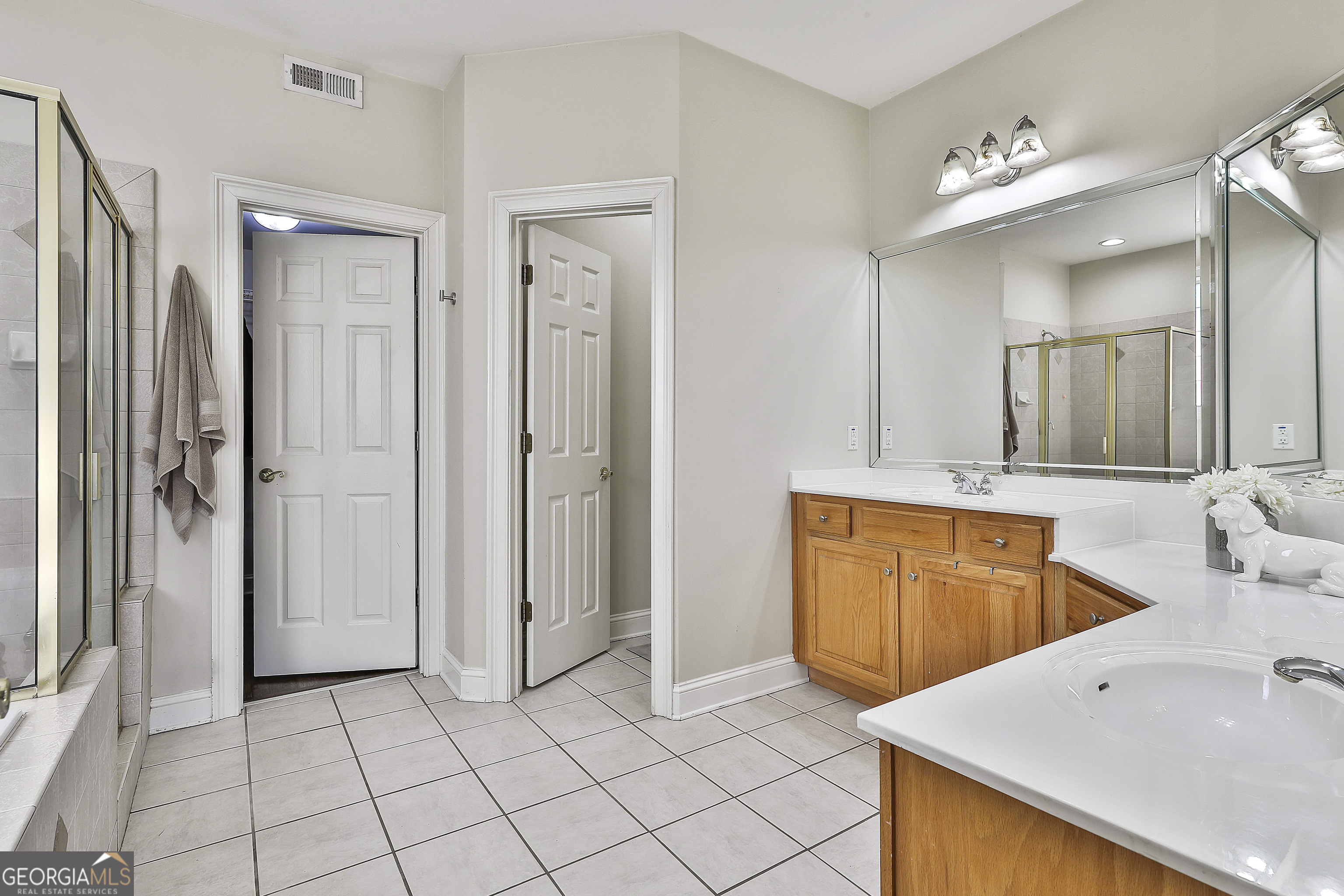 80 Middleton Trace Newnan, GA 30265 - Photo 34 of 92 a spacious bathroom with a sink double vanity and a mirror