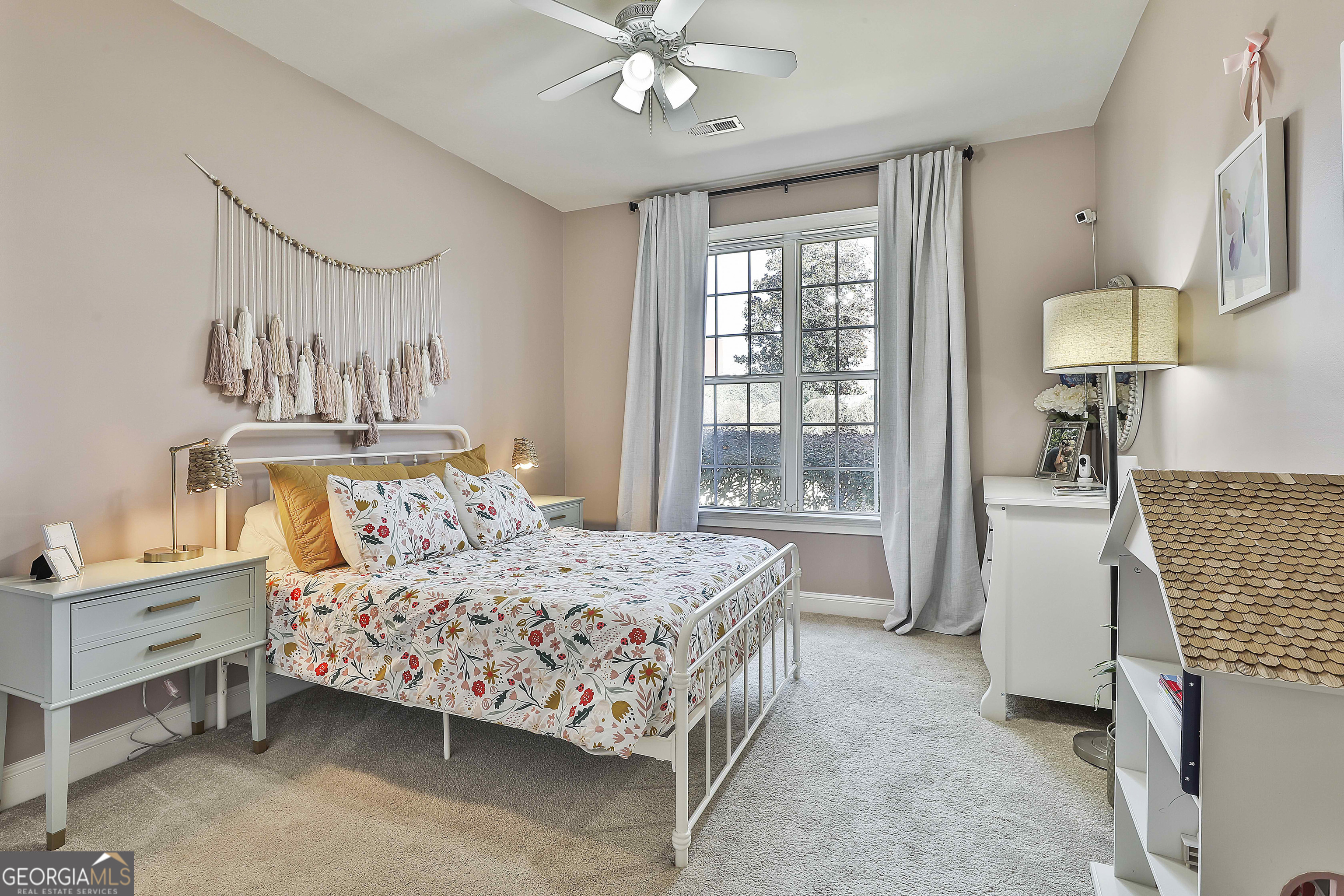 80 Middleton Trace Newnan, GA 30265 - Photo 38 of 92 a bedroom with a bed chandelier and a window