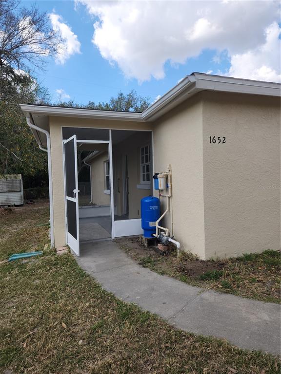1652 Southwest Harlem Circle Arcadia, FL 34266 - Photo 14 of 17 a view of a house with a yard