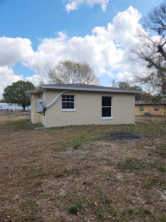 1652 Southwest Harlem Circle Arcadia, FL 34266 - Photo 16 of 17 a backyard of a house with lots of green space