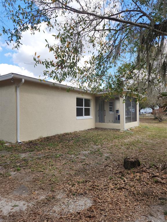 1652 Southwest Harlem Circle Arcadia, FL 34266 - Photo 17 of 17 a house with trees in front of it