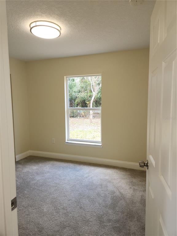 1652 Southwest Harlem Circle Arcadia, FL 34266 - Photo 2 of 17 an empty room with a window