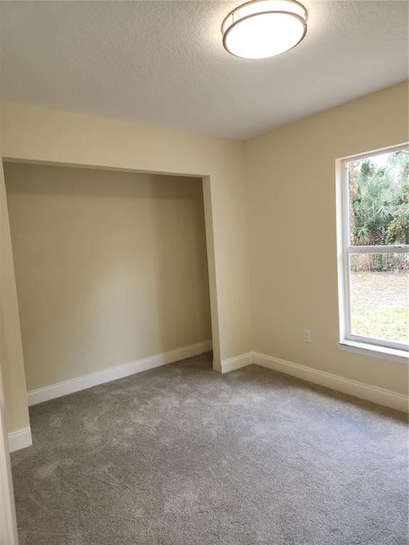 1652 Southwest Harlem Circle Arcadia, FL 34266 - Photo 3 of 17 an empty room with a window