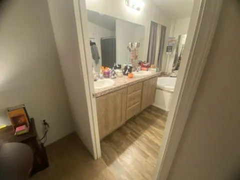 a bedroom with a bed and flat screen tv