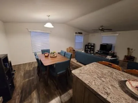a kitchen with a table and chairs in it