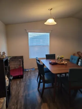 a dining room with a table and chairs