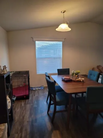a dining room with a table and chairs