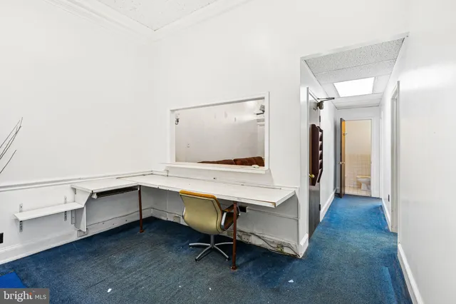 a room with a table and chairs