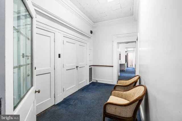 a living room with furniture and a gate