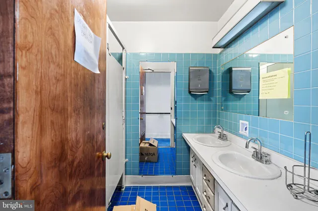 a bathroom with a sink and mirror