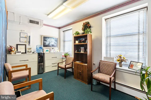 a work room with furniture and a window