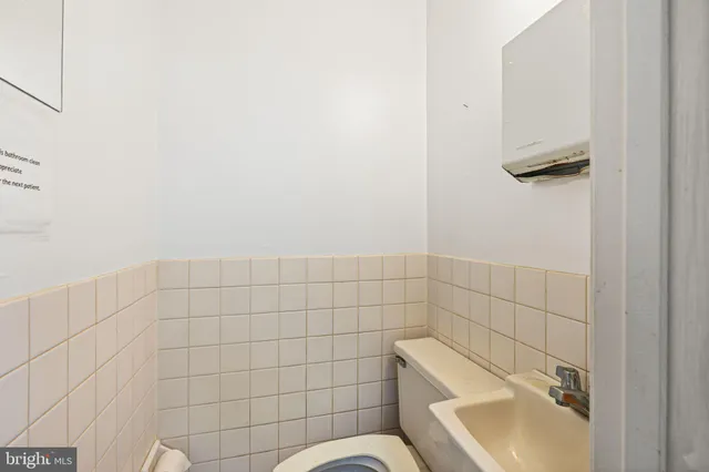 a bathroom with a sink and toilet