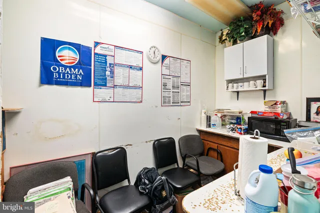 a work place with furniture and a potted plant