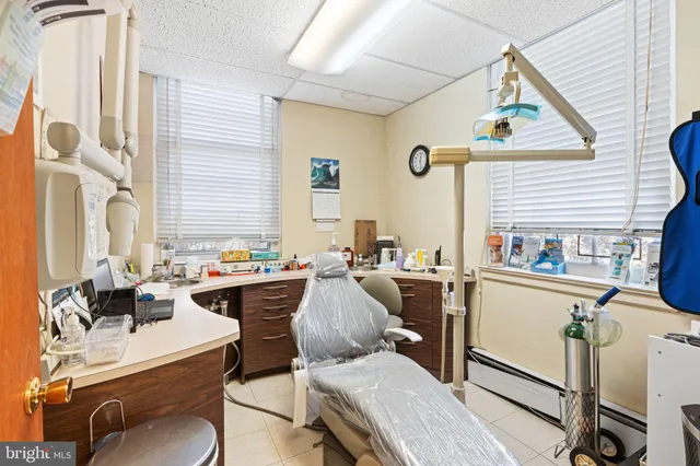 a living room with furniture stove and a window