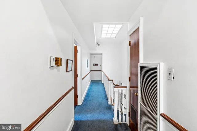 a view of entryway with wooden floor and stairs