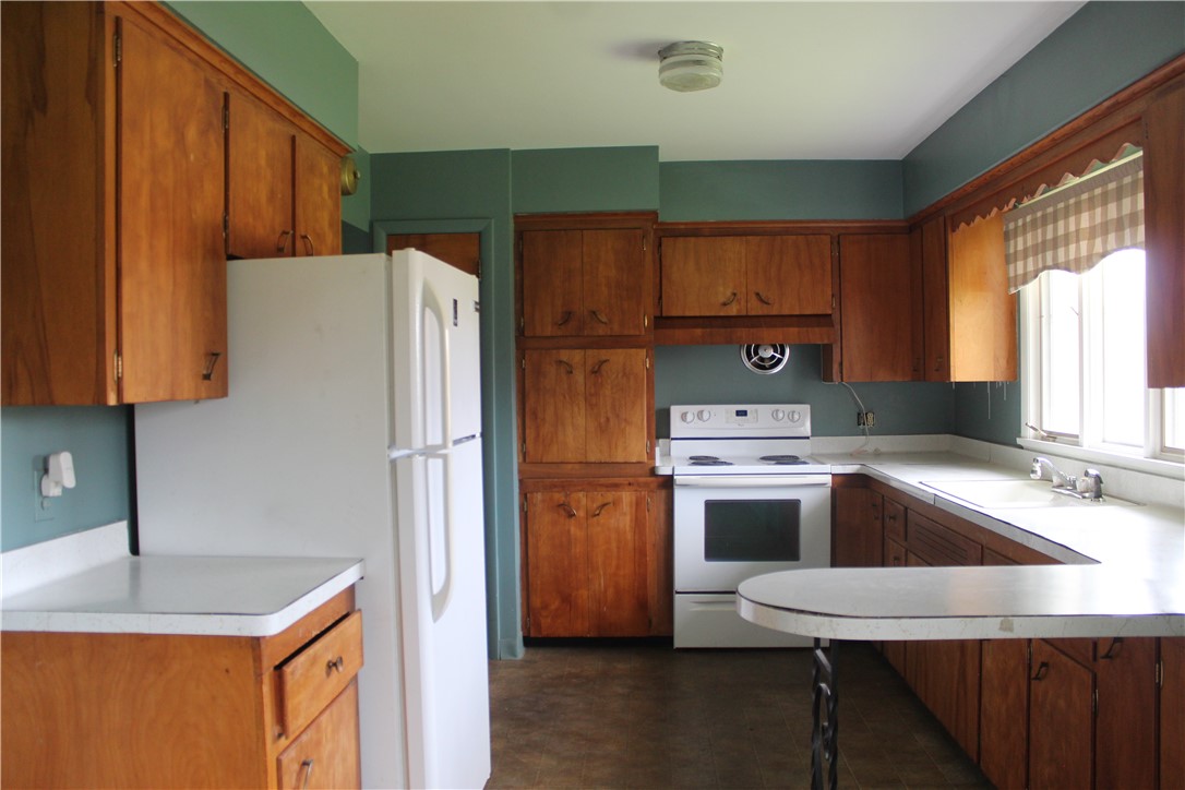 2247 Ridge Road Ontario, NY 14519 - Photo 16 of 36 Plenty of cabinets and a pantry