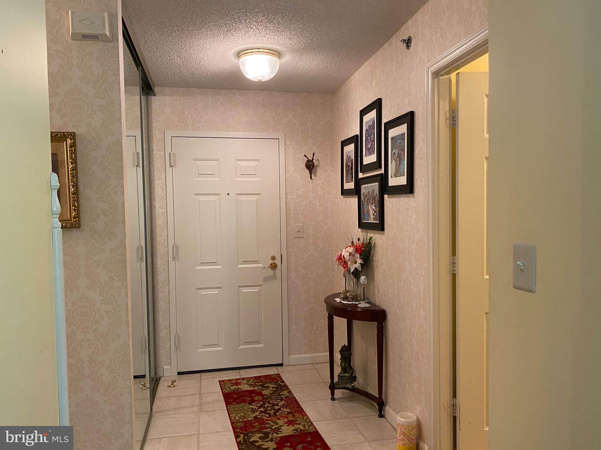 19385 Cypress Ridge Terrace, Unit 802 Leesburg, VA 20176 - Photo 3 of 15 Large foyer with huge coat closet