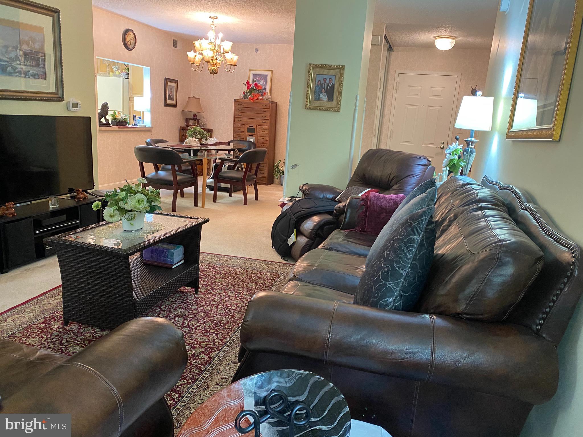 19385 Cypress Ridge Terrace, Unit 802 Leesburg, VA 20176 - Photo 6 of 15 Open concept living room dining room to solarium