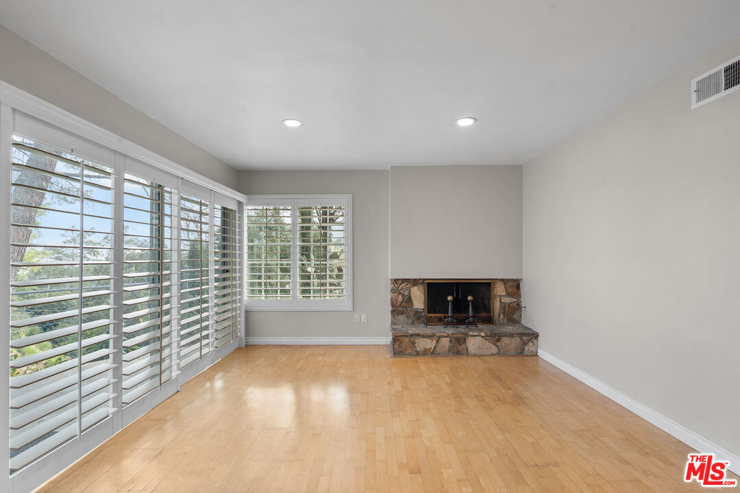 9631 Crystal View Drive Tujunga, CA 91042 - Photo 15 of 37 a view of empty room with a fireplace