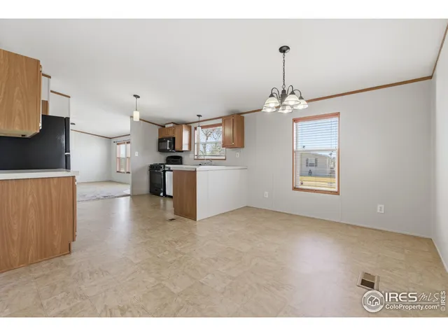 a view of a kitchen with a sink and a window