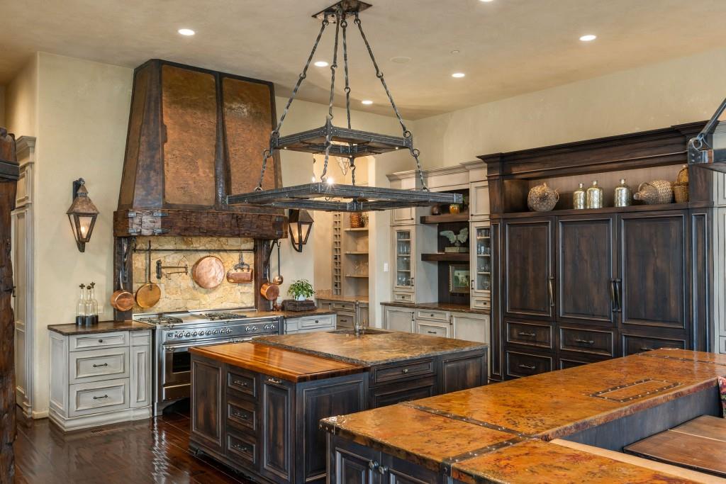 550 Blue Heron Way Milton, GA 30004 - Photo 18 of 108 a kitchen with stainless steel appliances granite countertop a stove a sink and a refrigerator