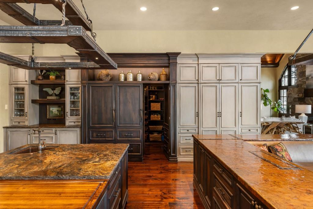 550 Blue Heron Way Milton, GA 30004 - Photo 19 of 108 a kitchen with stainless steel appliances granite countertop a sink and a refrigerator