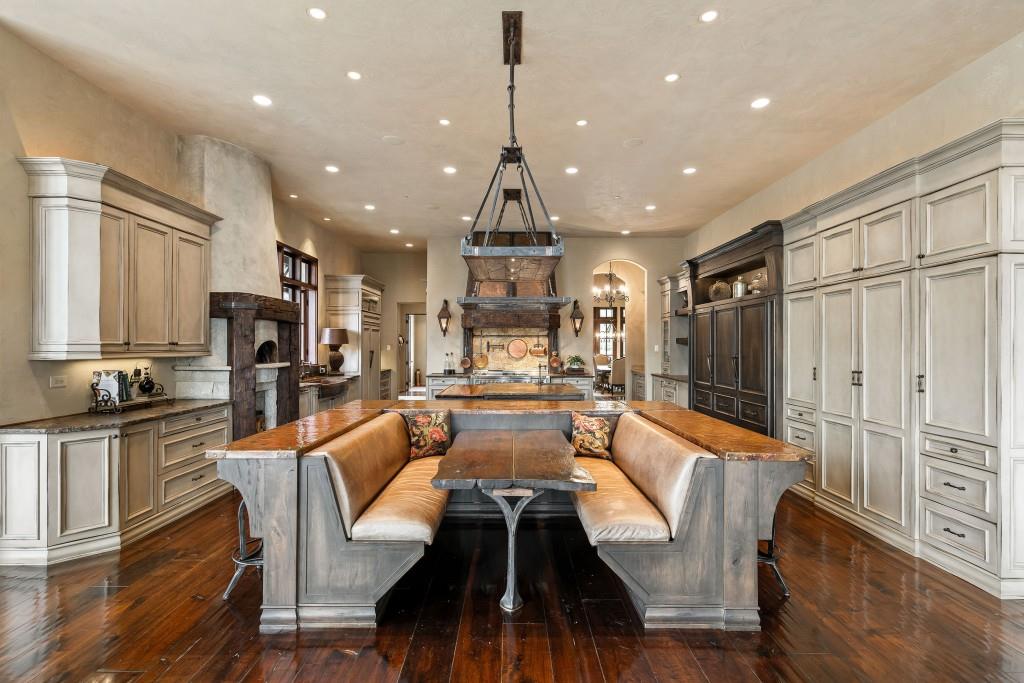 550 Blue Heron Way Milton, GA 30004 - Photo 24 of 108 a view of a dining room with furniture a chandelier and wooden floor