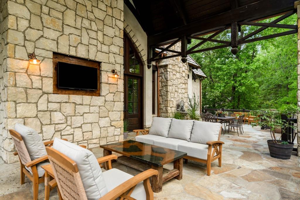 550 Blue Heron Way Milton, GA 30004 - Photo 30 of 108 a outdoor living space with furniture and a flat screen tv