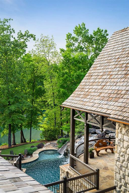 550 Blue Heron Way Milton, GA 30004 - Photo 32 of 108 a view of a patio with table and chairs and potted plants