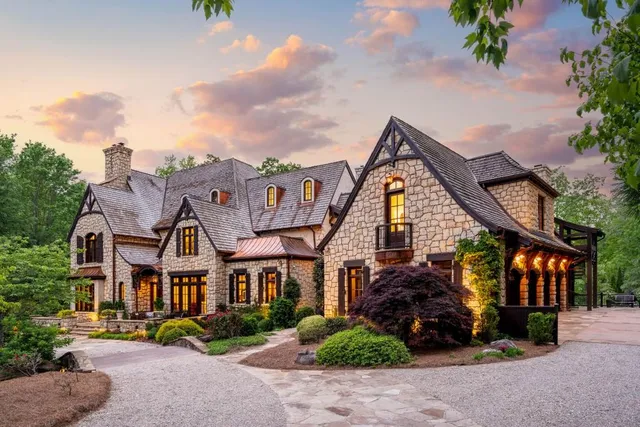 a living room with furniture and two window