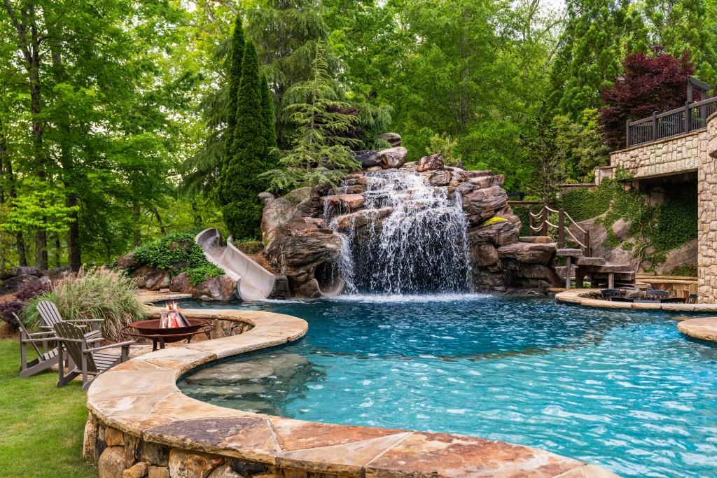 550 Blue Heron Way Milton, GA 30004 - Photo 80 of 108 a view of a house with backyard swimming pool and sitting area