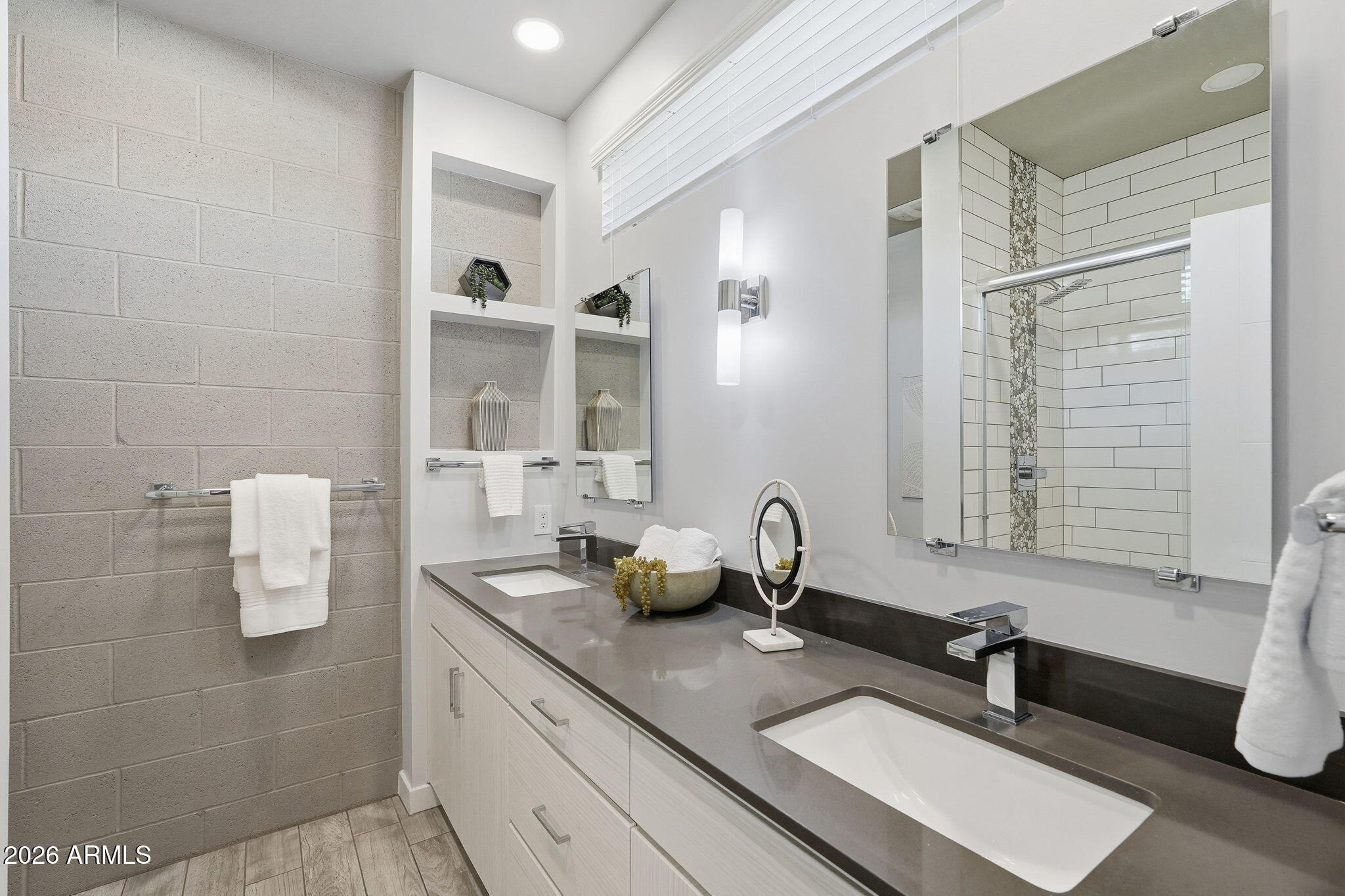 2727 East Thomas Road, Unit 5 Phoenix, AZ 85016 - Photo 31 of 41 a bathroom with a double vanity sink and mirror