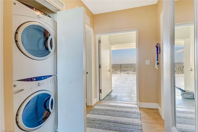 a view of a hallway with washer and dryer